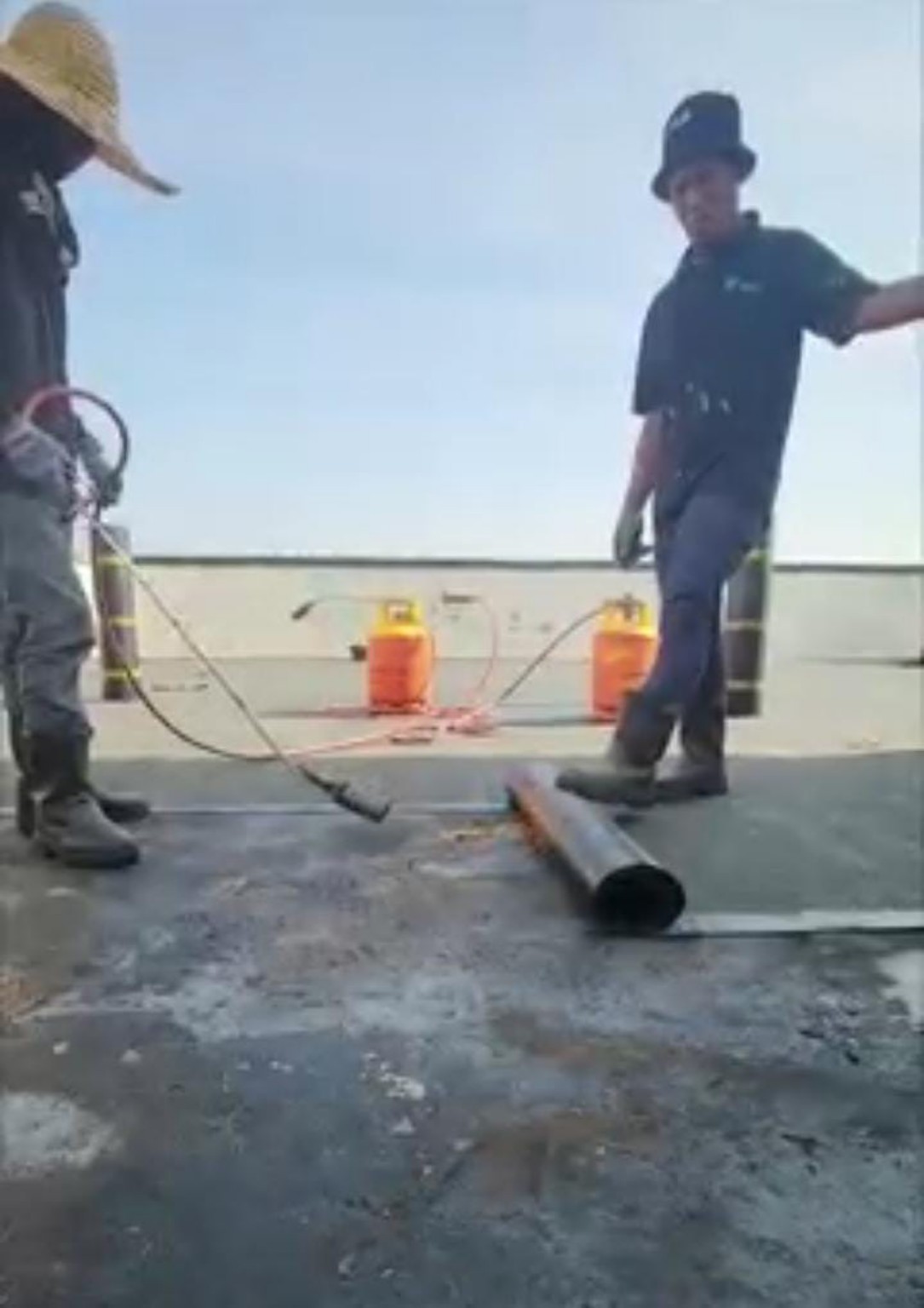 Torch-on membrane installation using a membrane roll and torch.