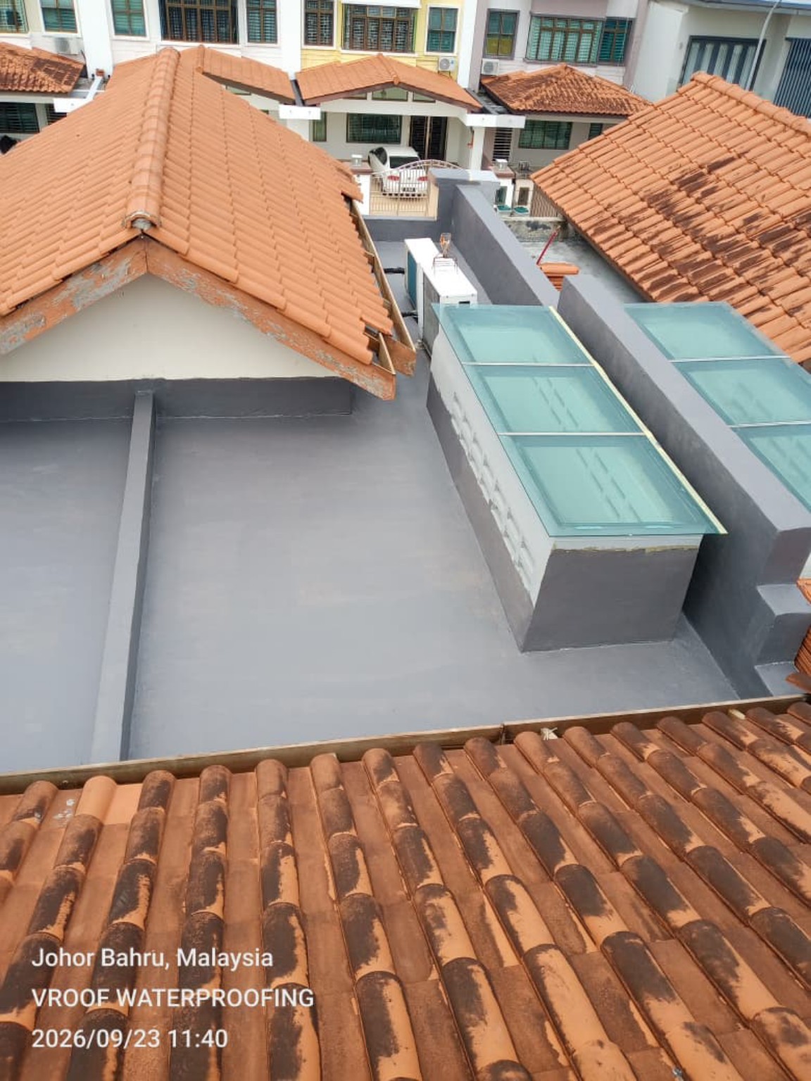 Completed waterproofing coating on a concrete roof area.